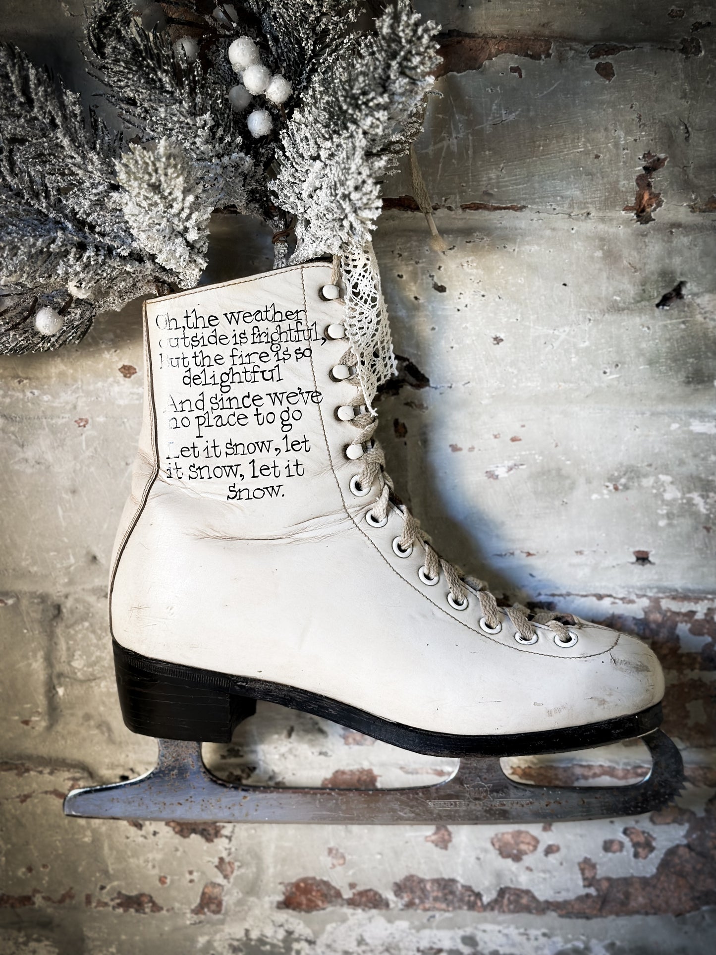 A beautiful vintage Christmas ice skate hand painted using traditional sign writer’s techniques and materials