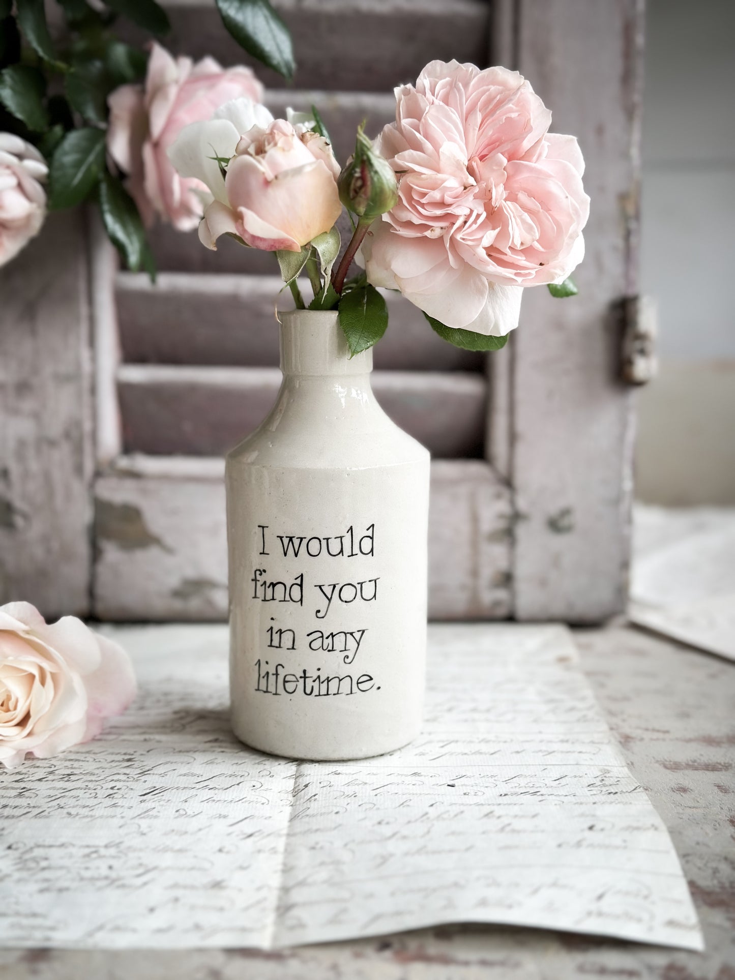 A Victorian unearthed stoneware pottery bottle with a hand painted quote