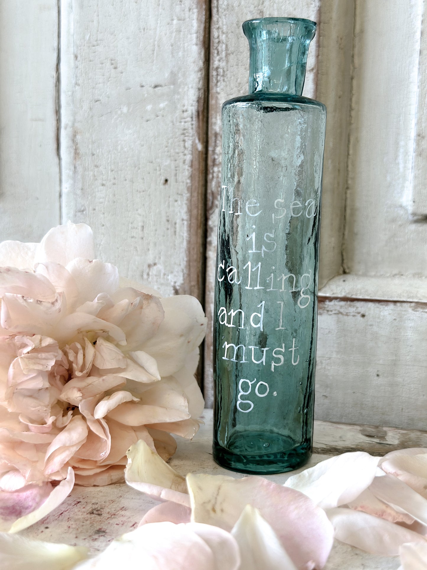 A beautiful Victorian bottle with a hand painted quote