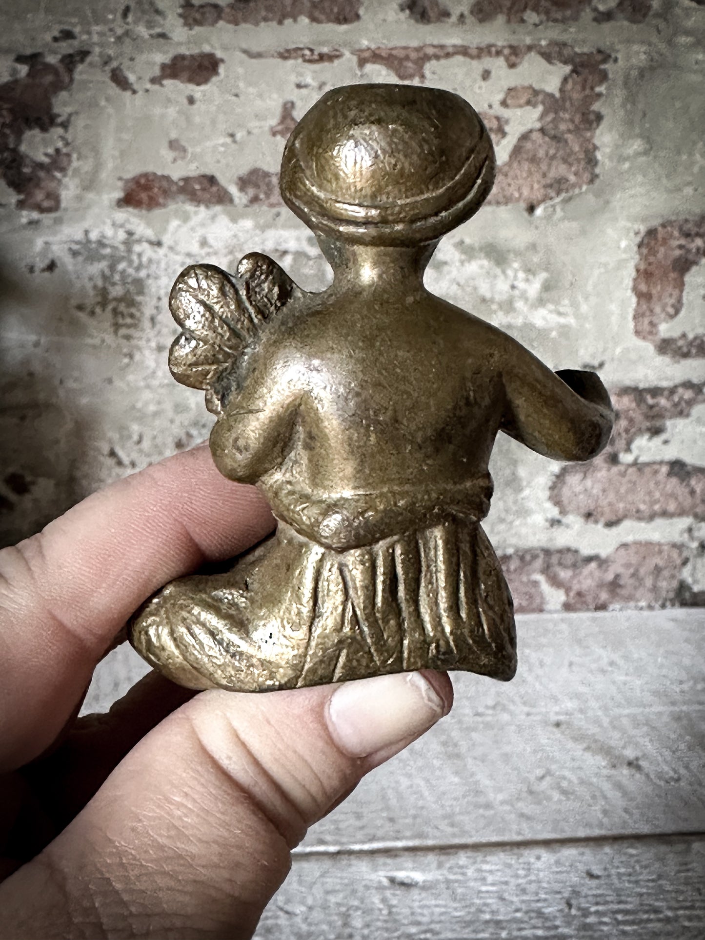 A Delightful Antique Bronze Decorative Seated Cherub