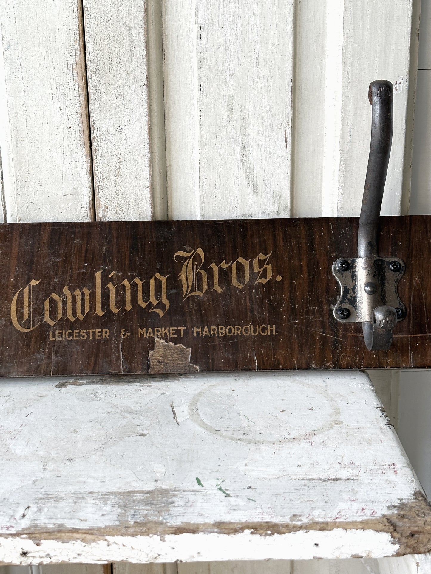 Salvaged sign written drawer front coat pegs