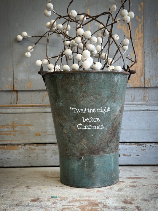 A Recycled Metal Mini Christmas Tree Bucket With A Hand Painted Quote