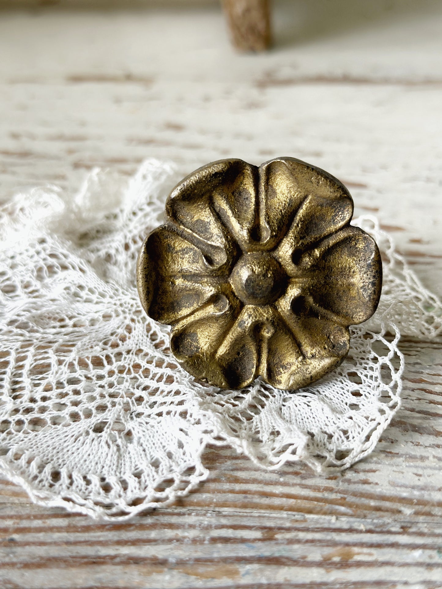 A pair of antique brass salvaged French curtain tie back hooks