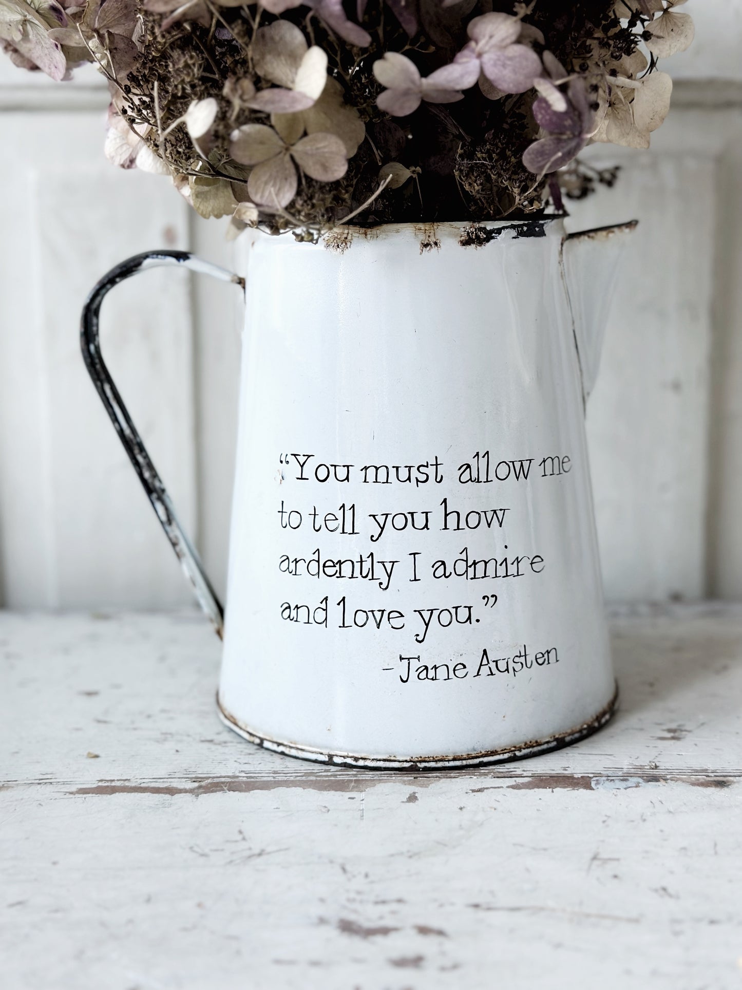 A hand painted quote on a beautiful Vintage white enamelware jug