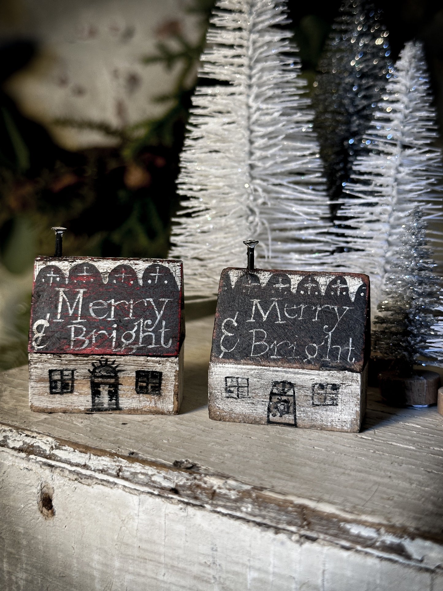 A pretty vintage German Erzgebirge Putz wooden village house painted with a Christmas quote