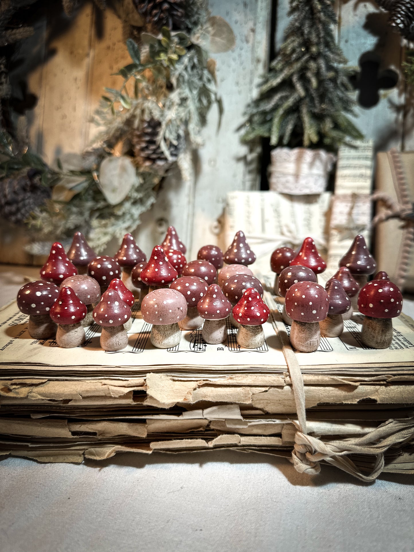 A wooden hand painted and trimmed Christmas village toadstool