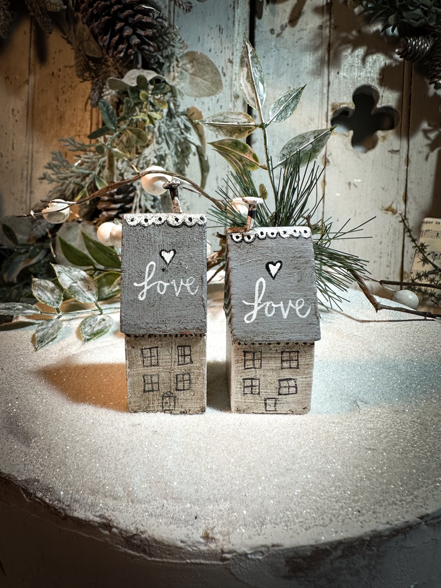 A pretty vintage German Erzgebirge Putz wooden village house painted with a Christmas quote