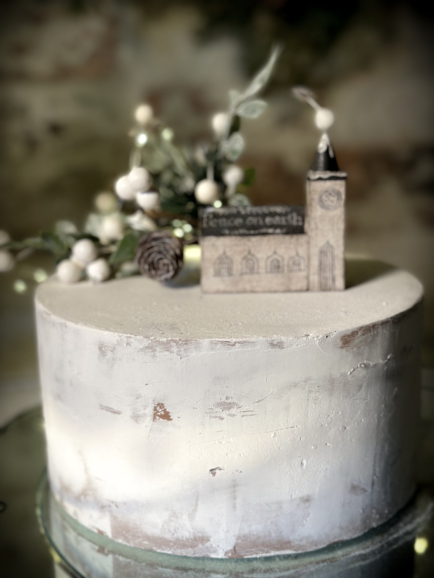 A pretty vintage German Erzgebirge Putz wooden village house painted with a Christmas quote