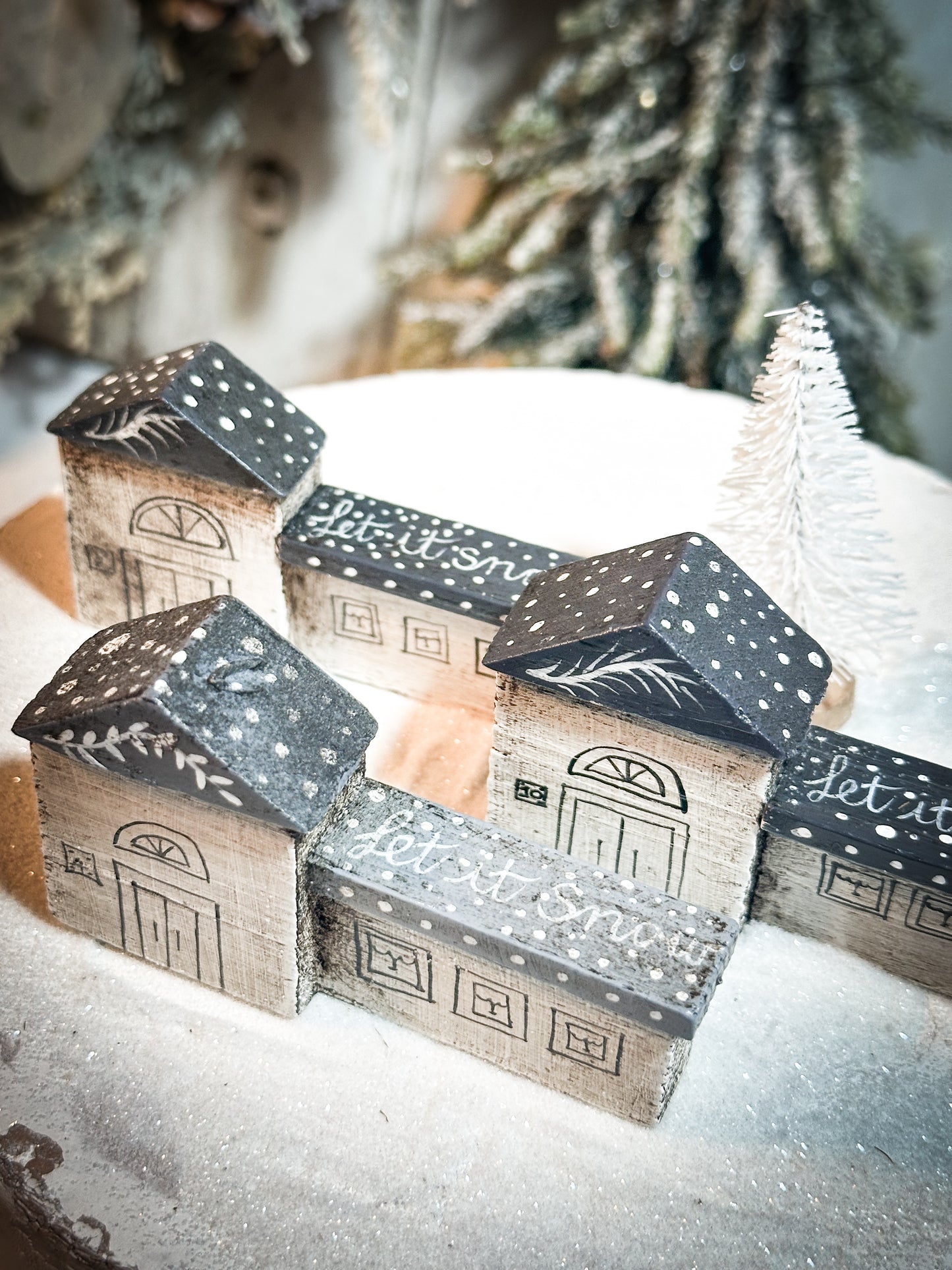 A pretty vintage German Erzgebirge Putz wooden village house painted with a Christmas quote