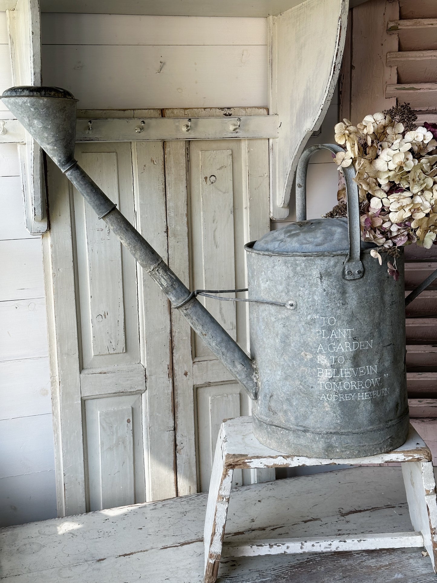 A beautiful vintage galvanised watering can planter