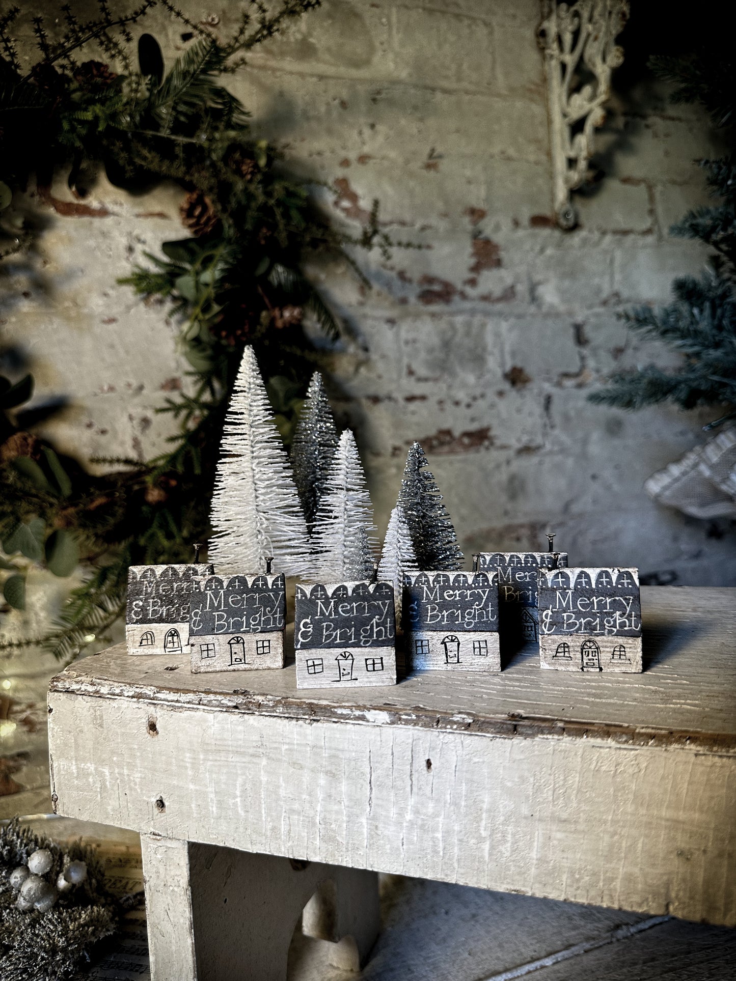 A pretty vintage German Erzgebirge Putz wooden village house painted with a Christmas quote