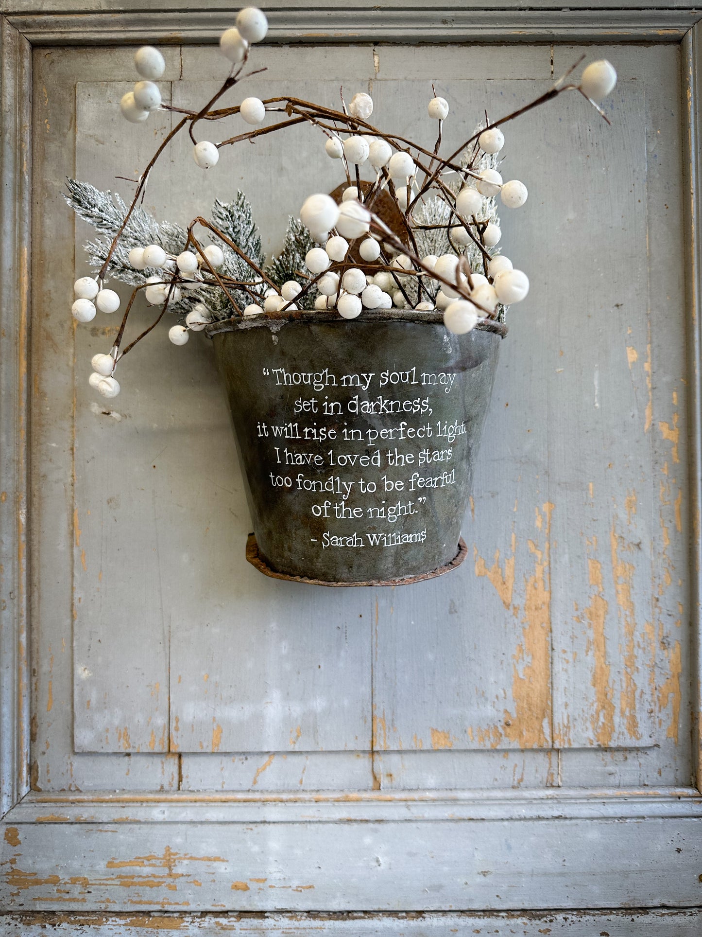 A Recycled Metal Candle Store With A Hand Painted Quote