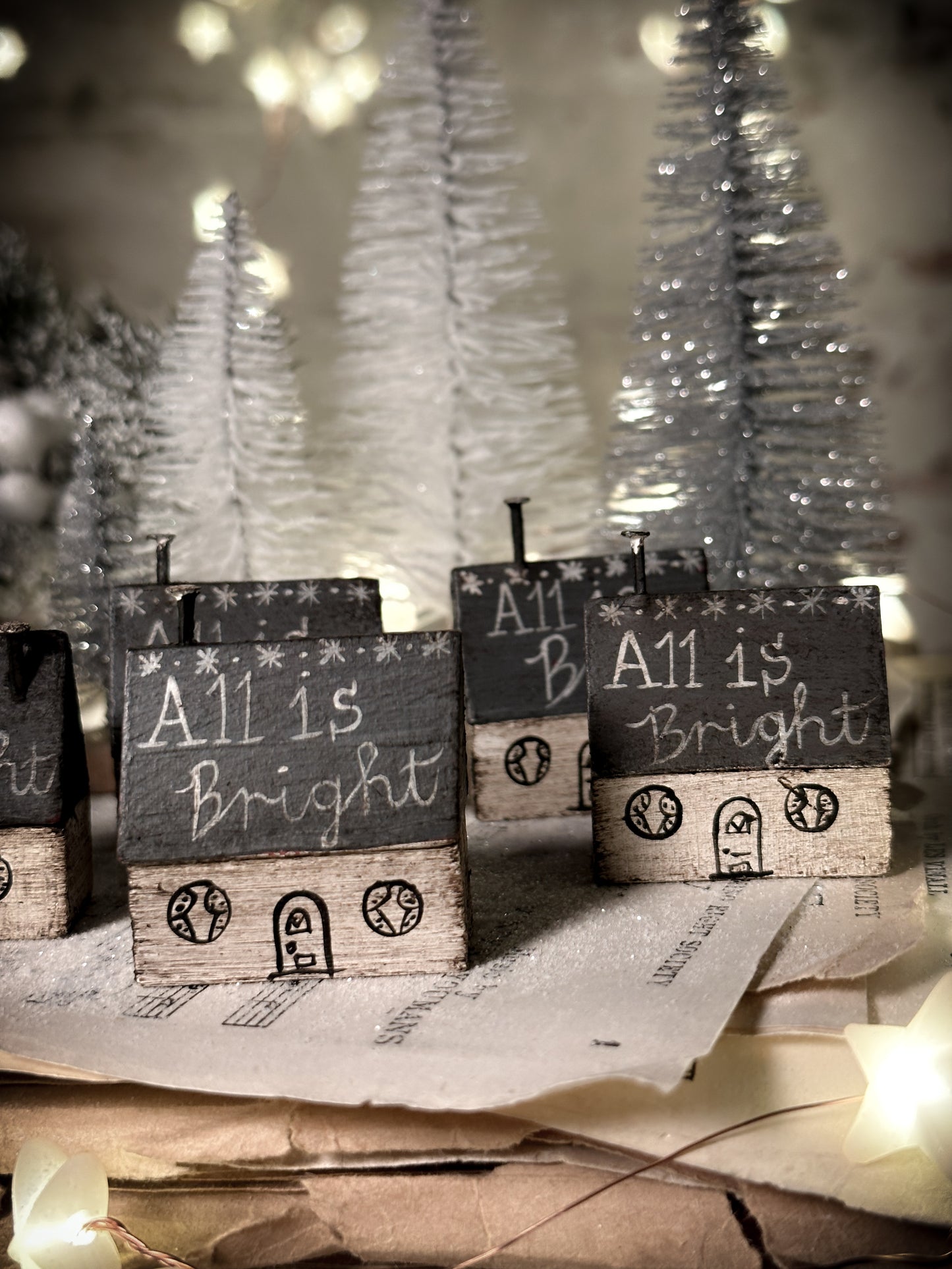 A pretty vintage German Erzgebirge Putz wooden village house painted with a Christmas quote