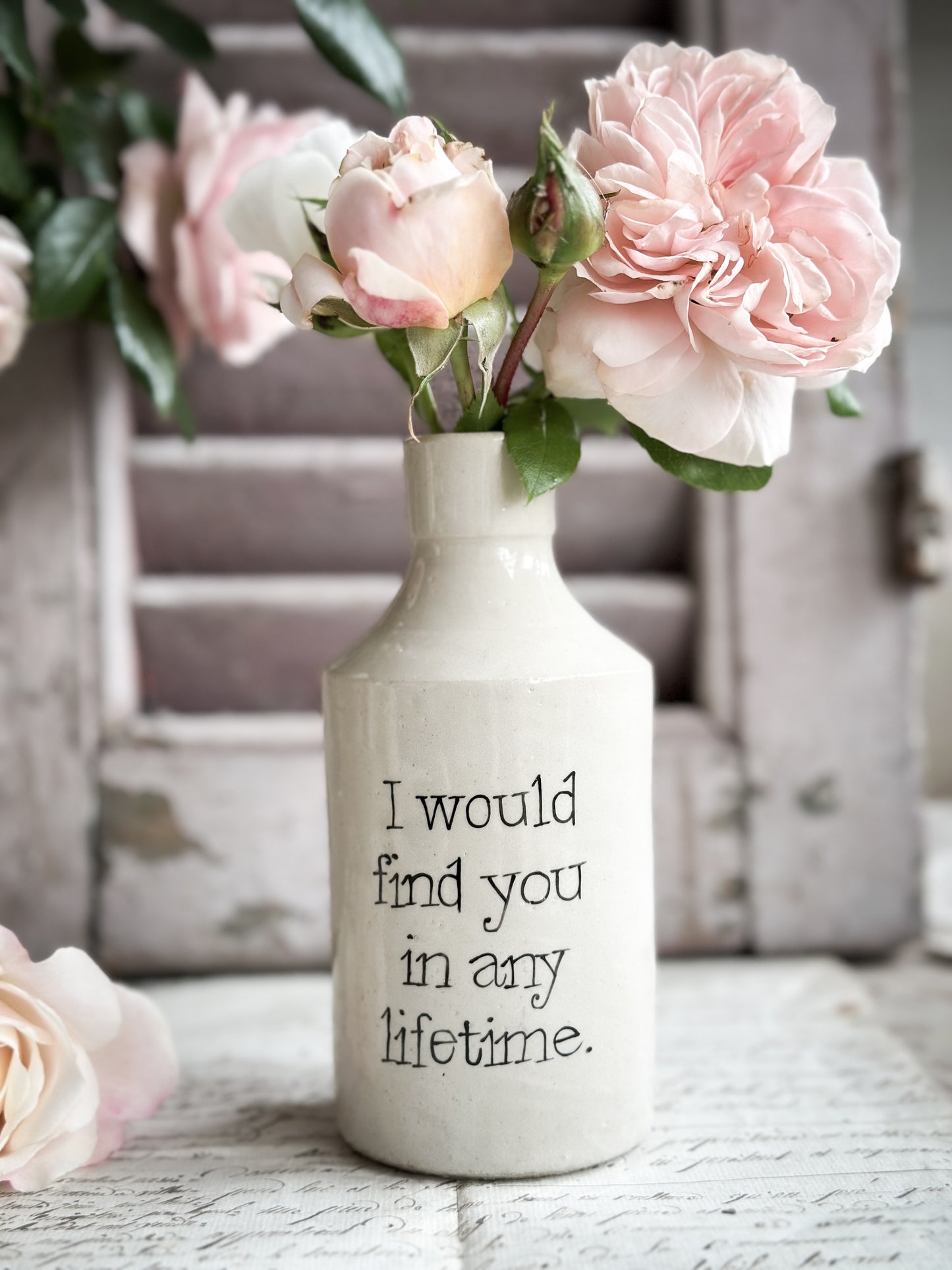 A Victorian unearthed stoneware pottery bottle with a hand painted quote