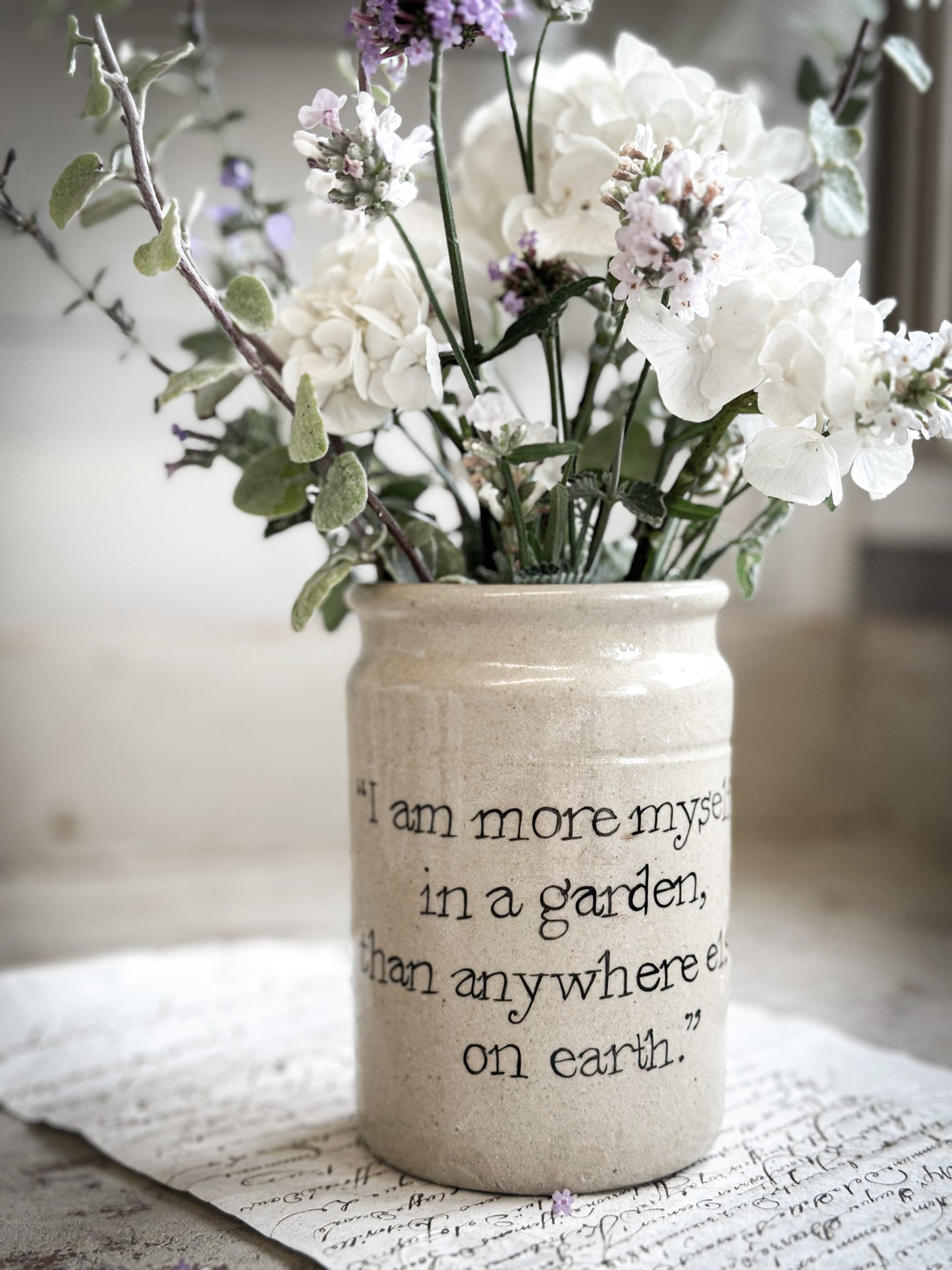 A Victorian unearthed short stoneware pottery jar with a hand painted quote