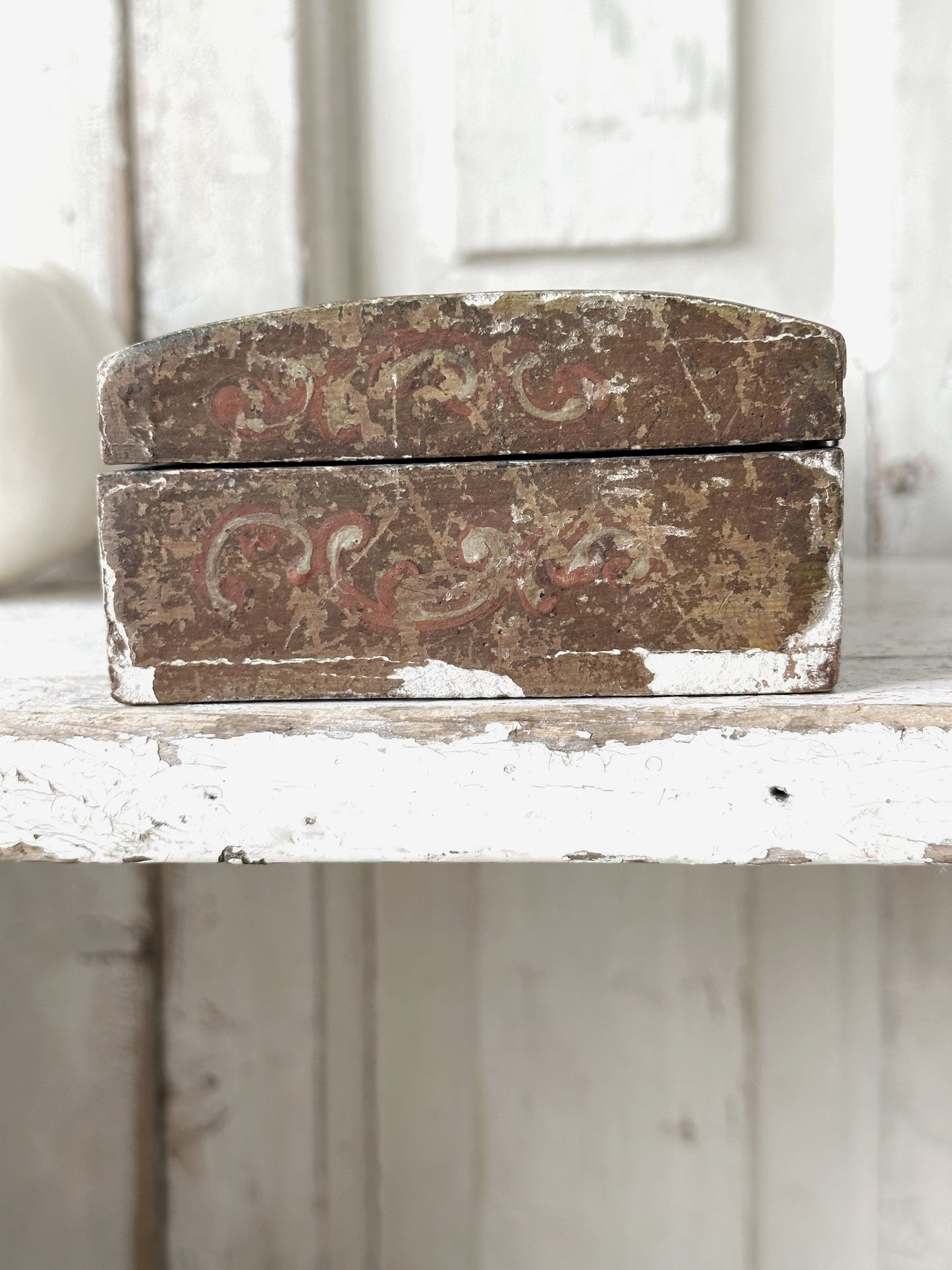 A beautiful antique painted box with floral detail