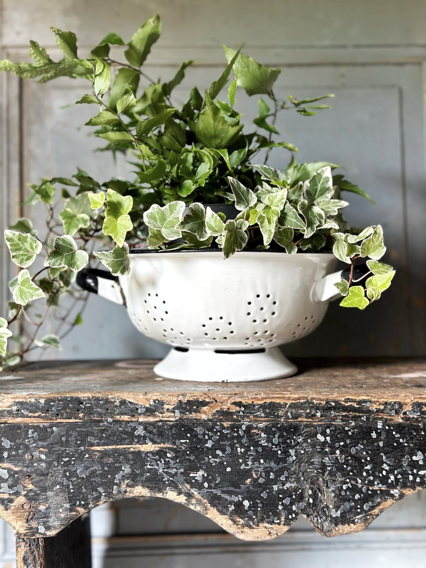 A gorgeous vintage white enamelware colander