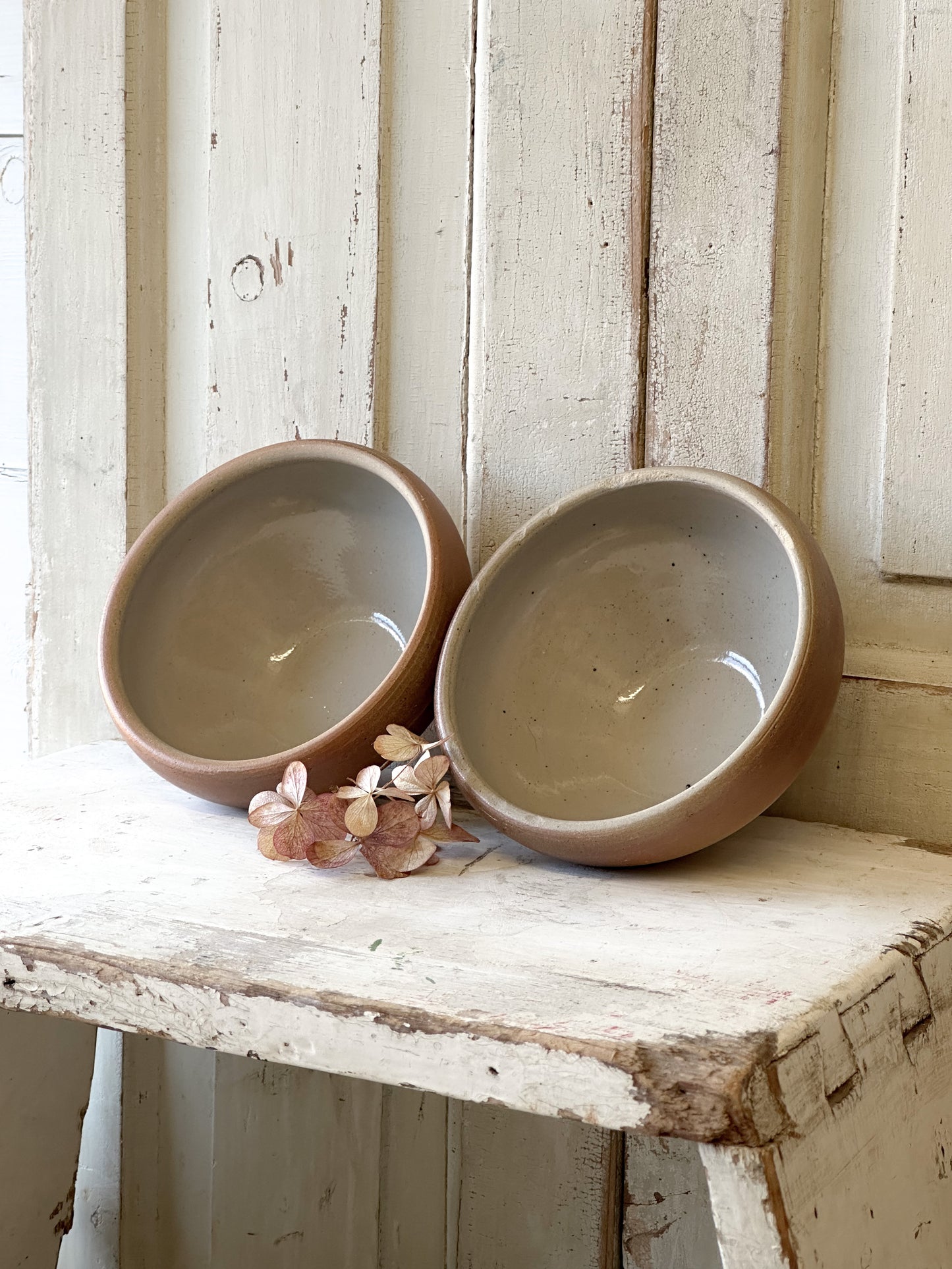 A pair of rustic antique French stoneware bowls