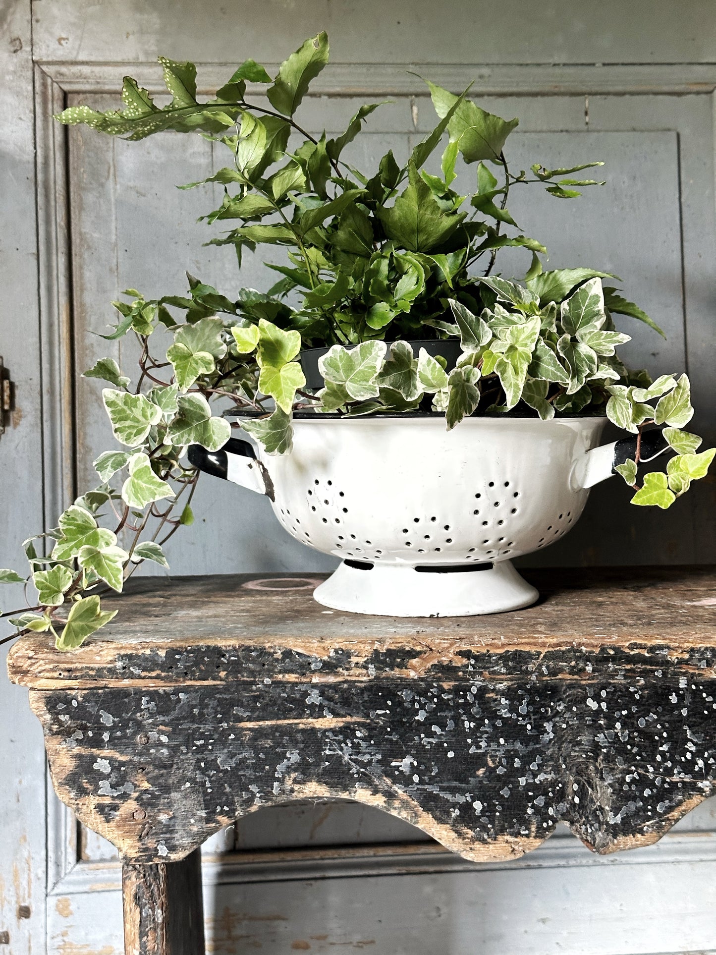 A gorgeous vintage white enamelware colander