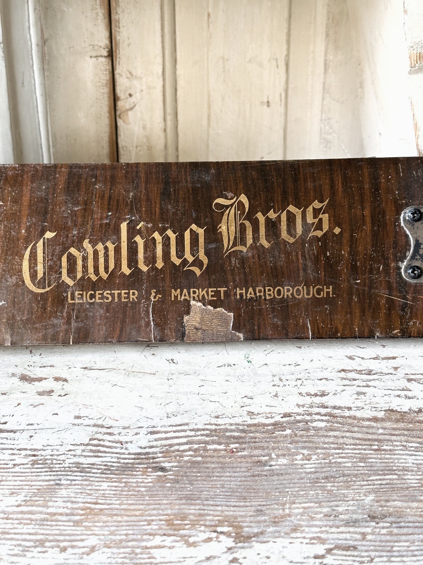 Salvaged sign written drawer front coat pegs
