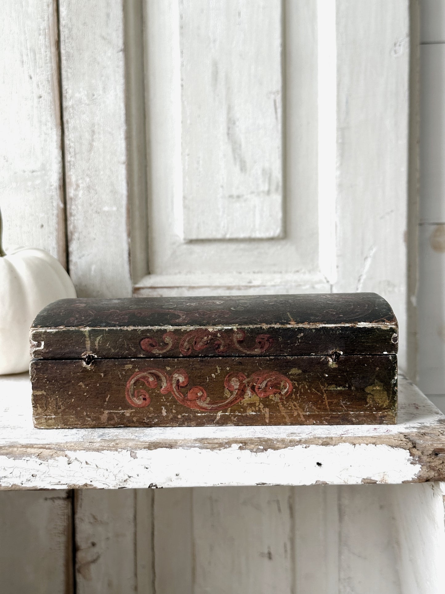 A beautiful antique painted box with floral detail