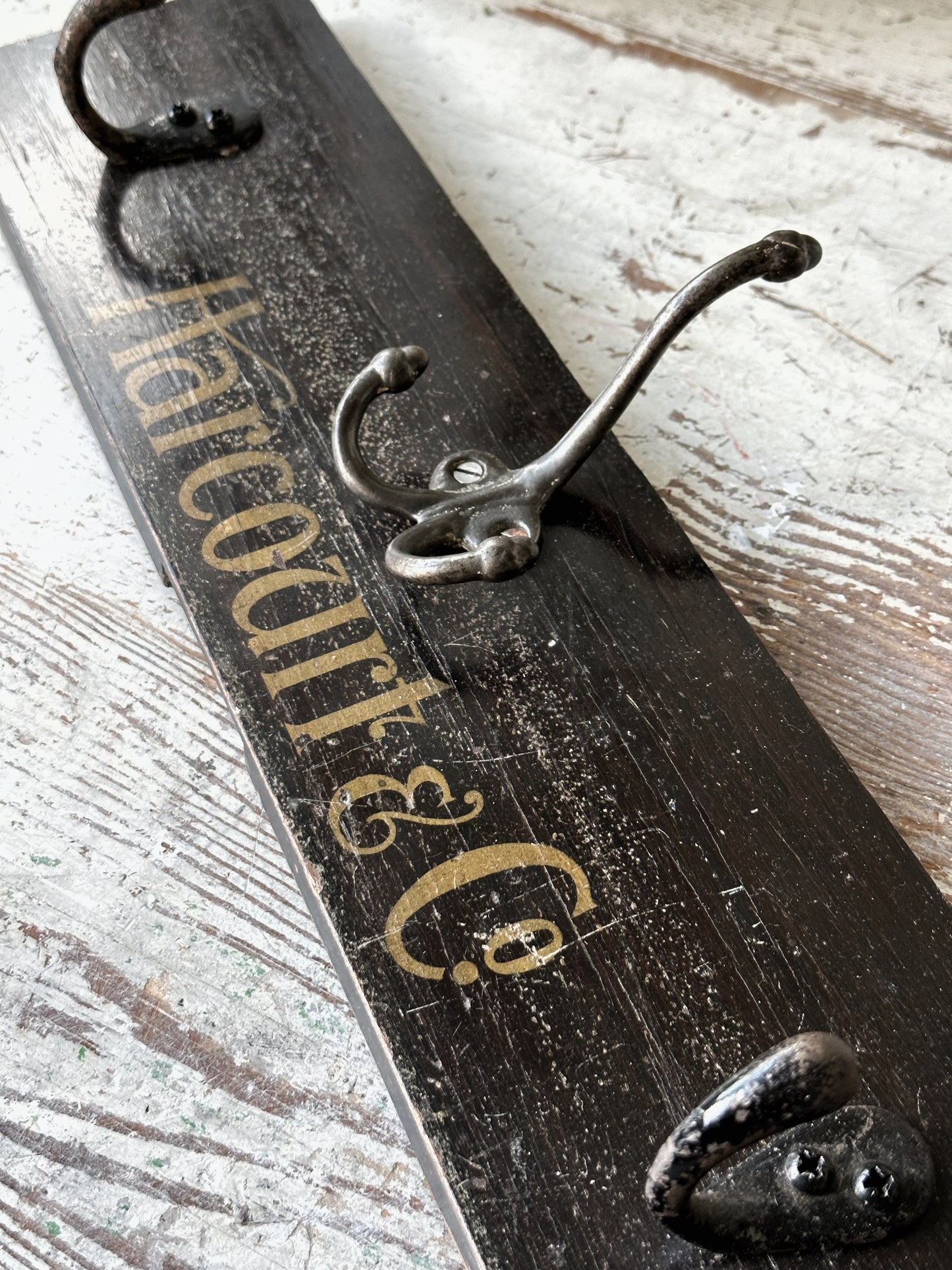 Salvaged sign written drawer front coat pegs