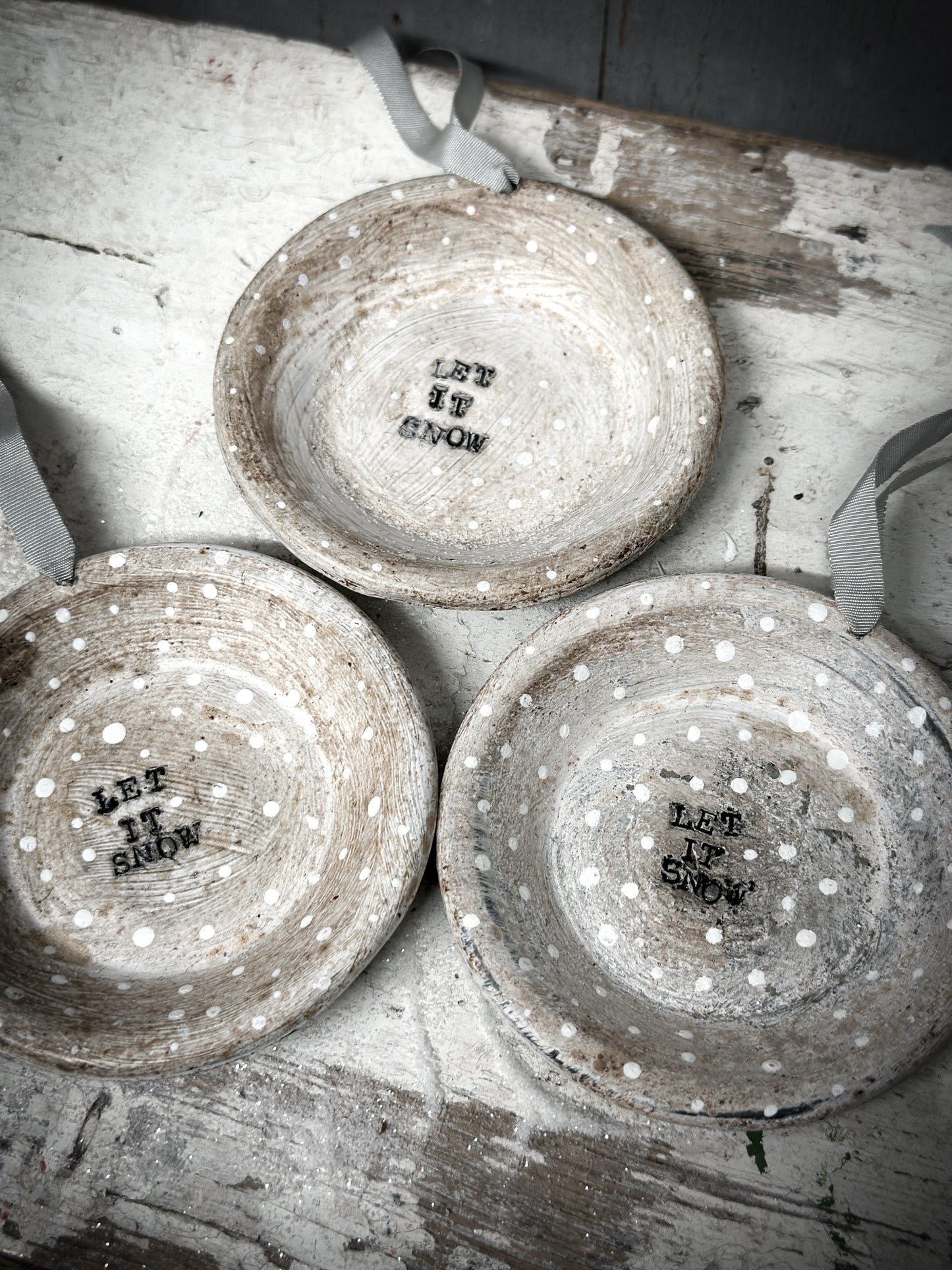 A Reworked French Patisserie Tin Christmas Decoration Stamped and Painted “Let It Snow”