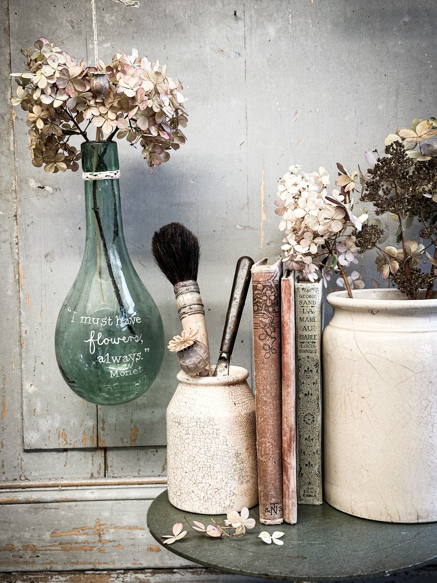 A beautiful antique hanging bulb bottle with a hand painted quote