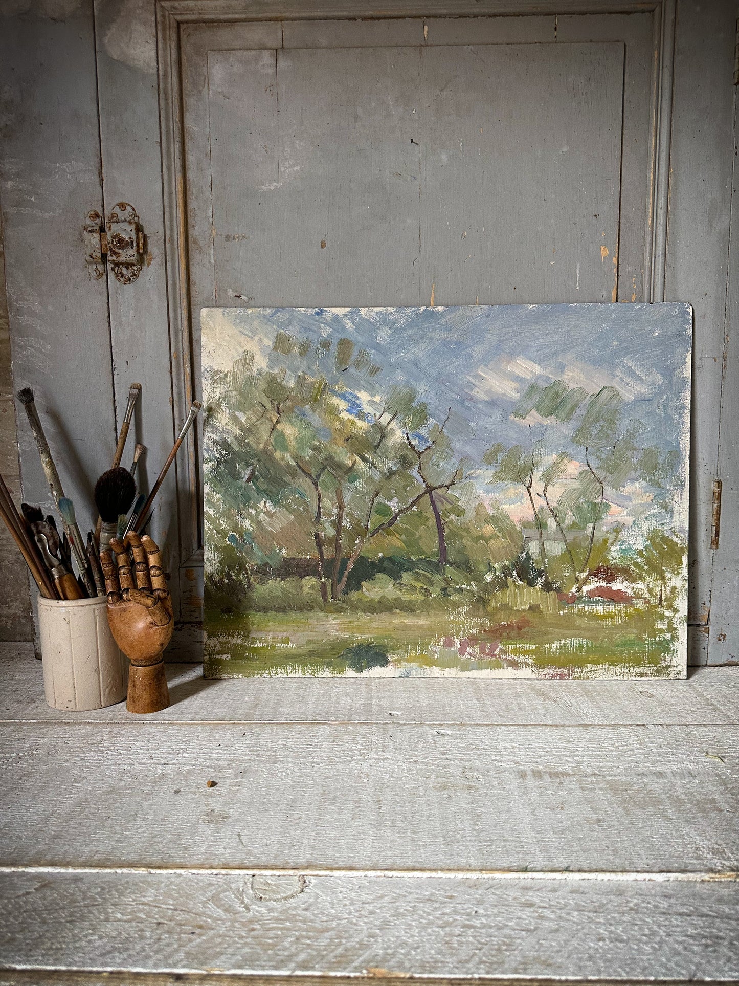 An Impressionist styled oil on board painting of a French landscape
