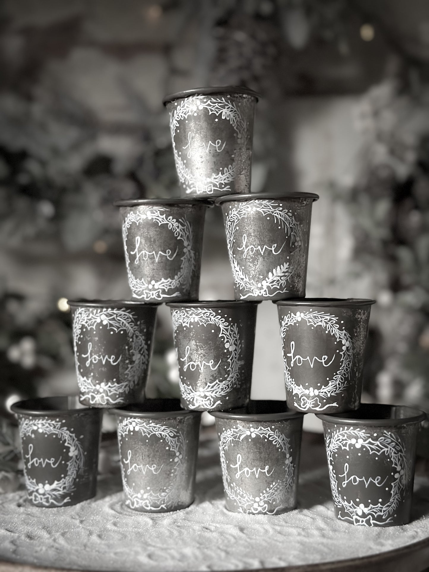 A pretty hand painted Dariole tin tea light holder