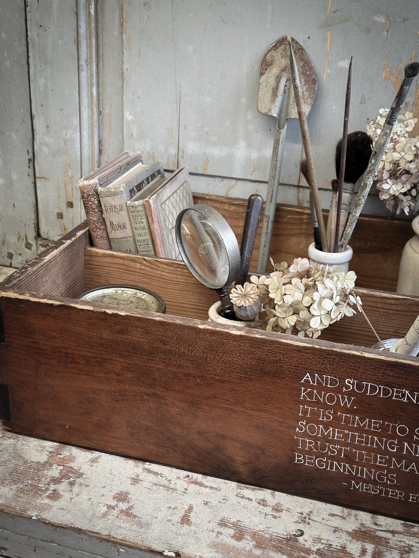 A Vintage Wooden Drawer With Hand Painted Quote