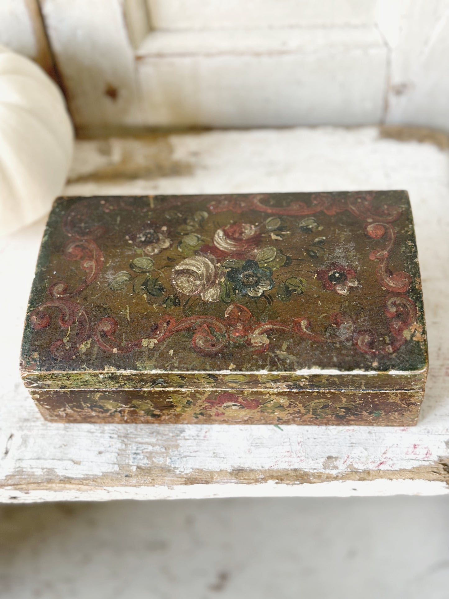 A beautiful antique painted box with floral detail