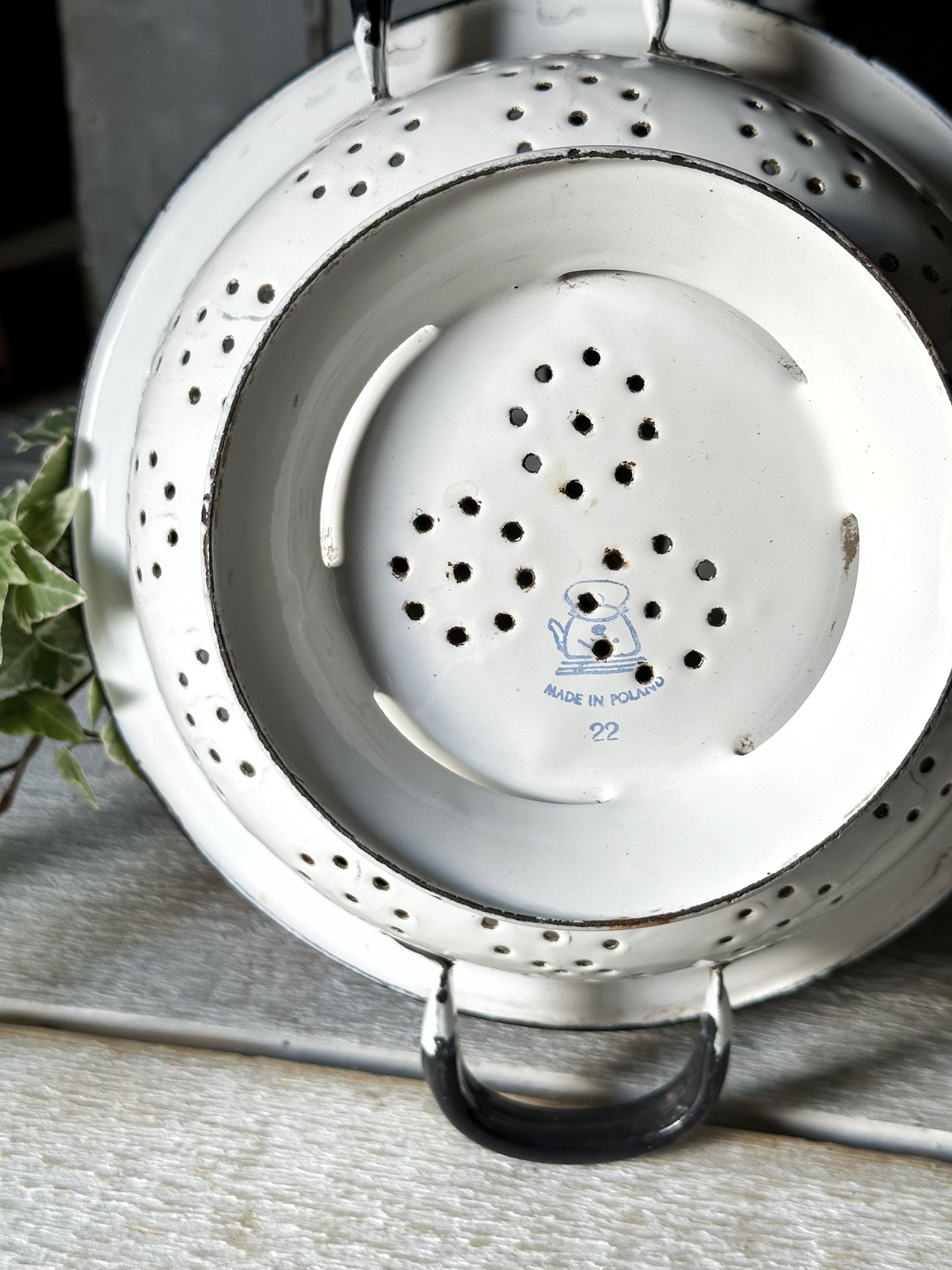 A gorgeous vintage white enamelware colander