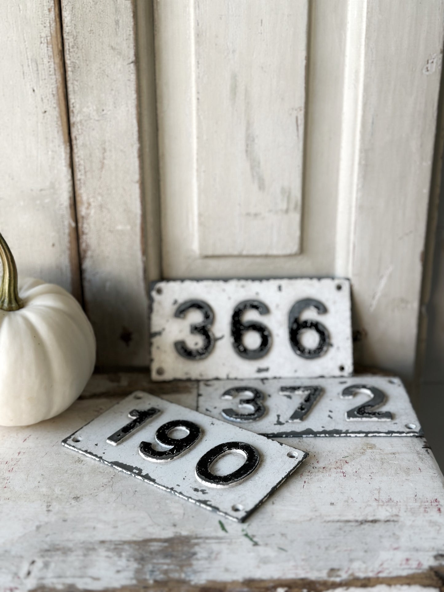 Three vintage French cast iron signs locker numbers