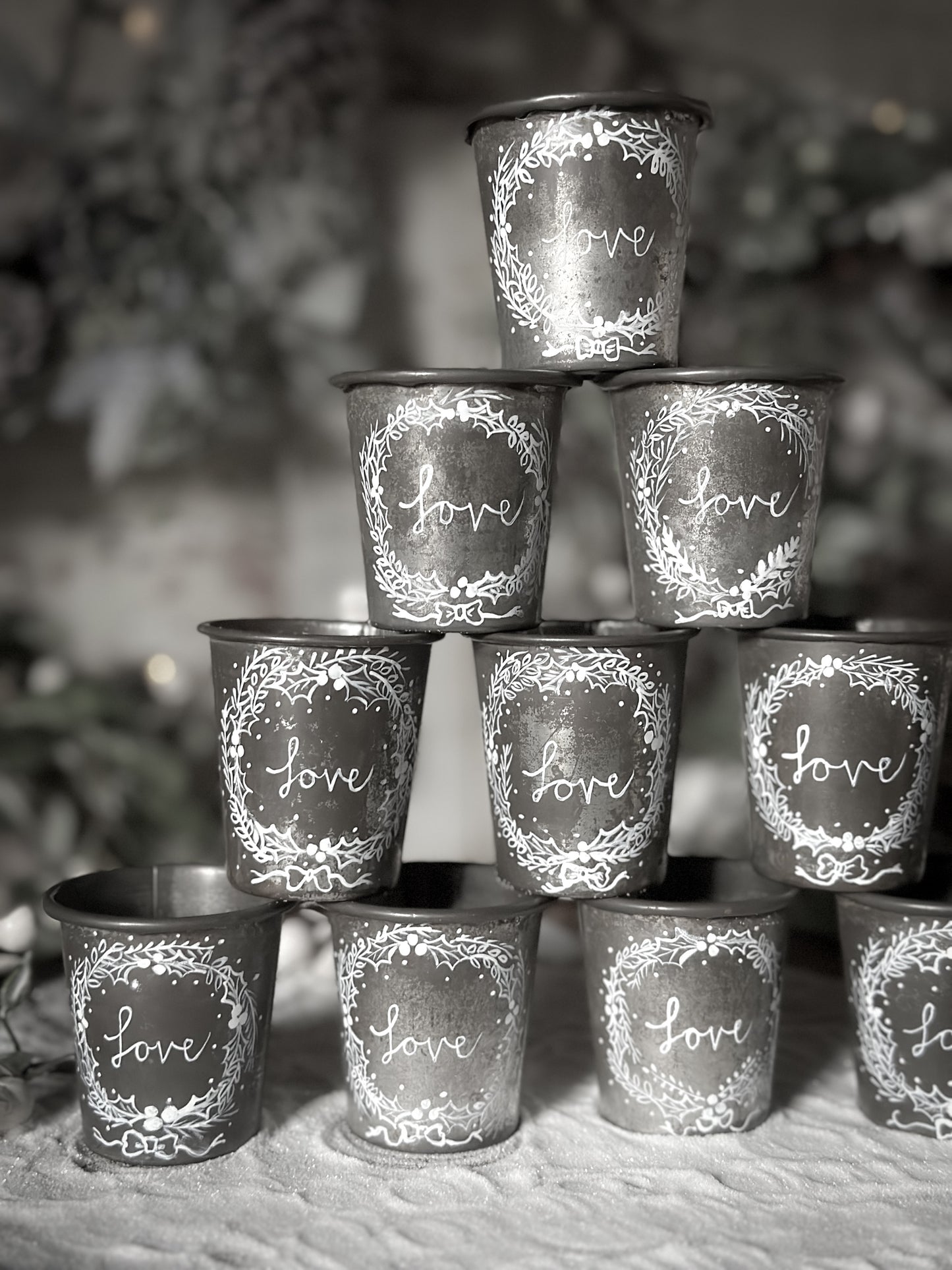 A pretty hand painted Dariole tin tea light holder