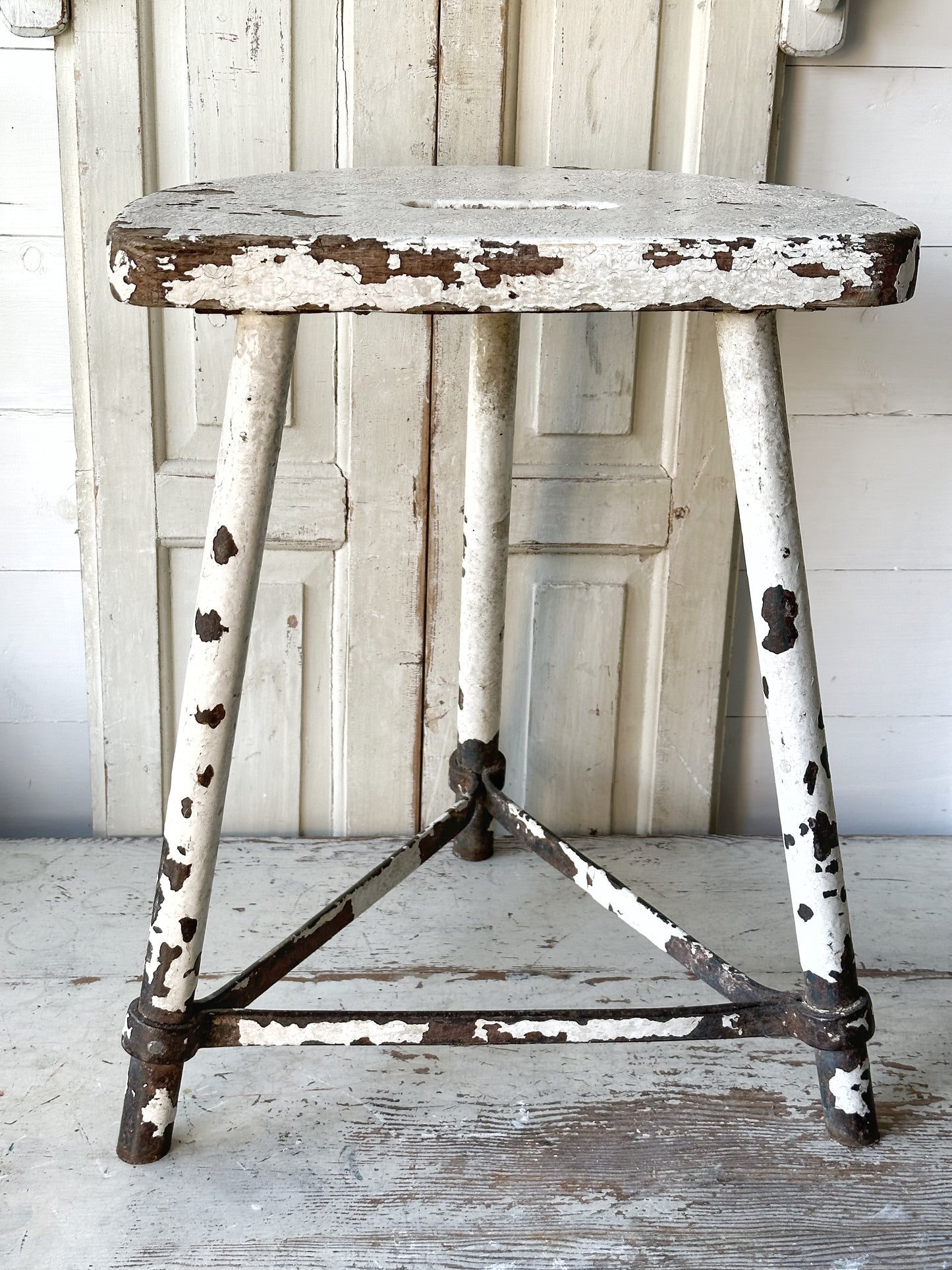 A chippy white French engineer’s stool 1930’s