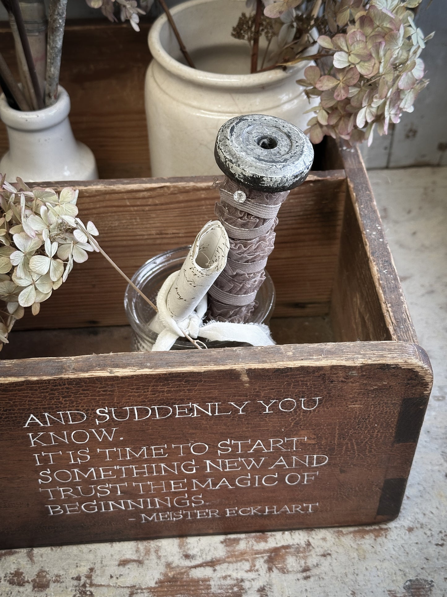 A Vintage Wooden Drawer With Hand Painted Quote