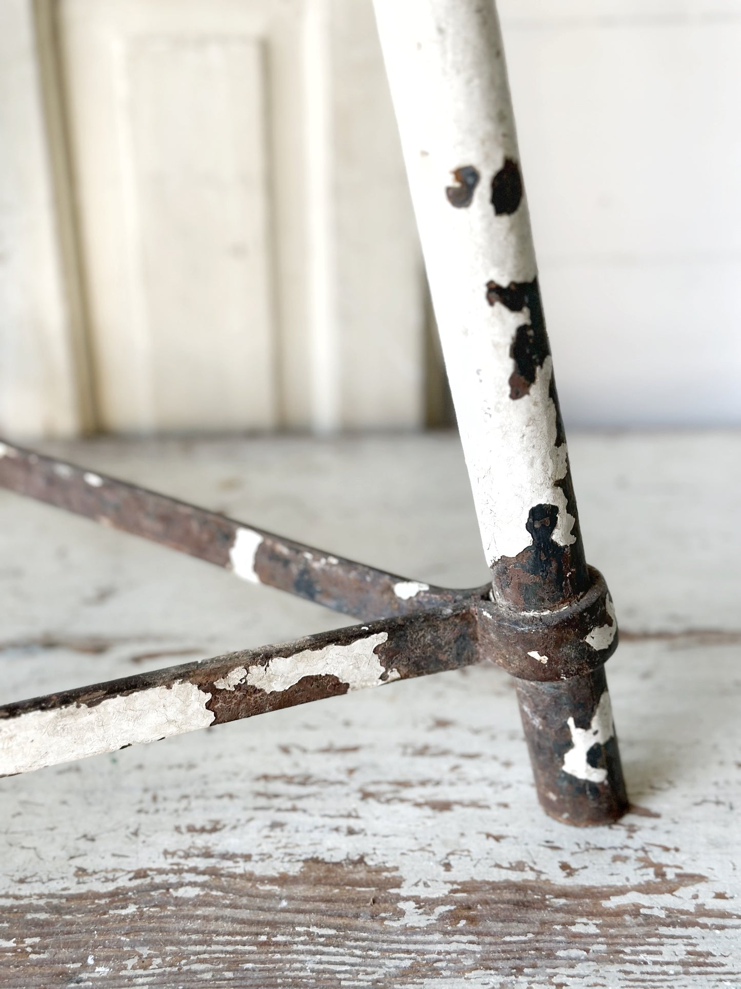 A chippy white French engineer’s stool 1930’s