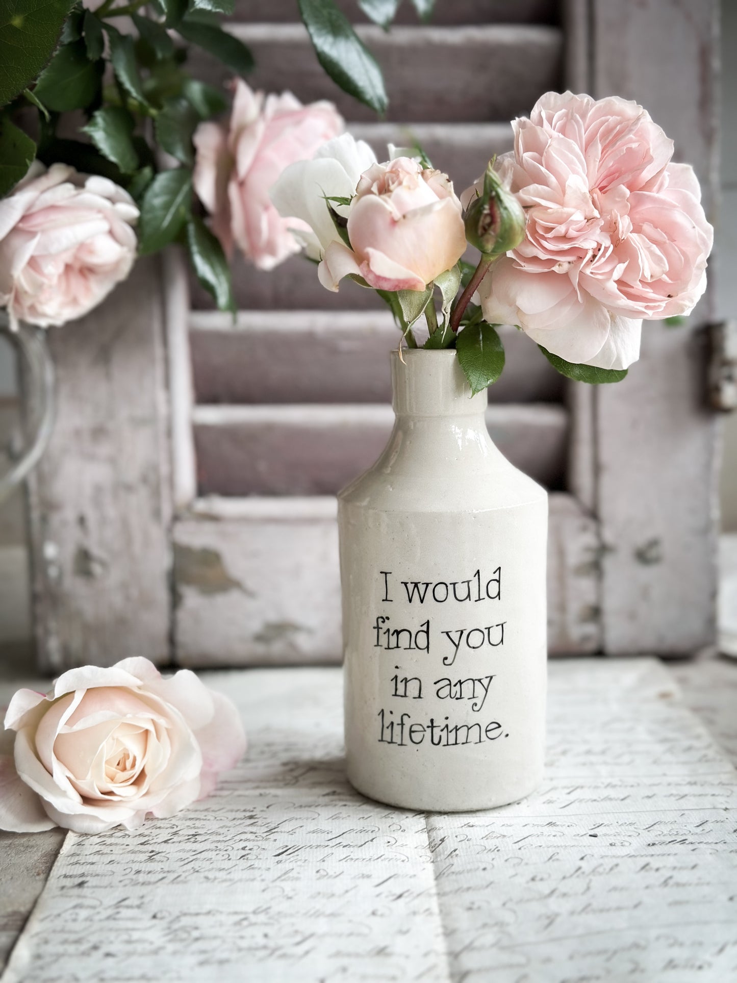 A Victorian unearthed stoneware pottery bottle with a hand painted quote