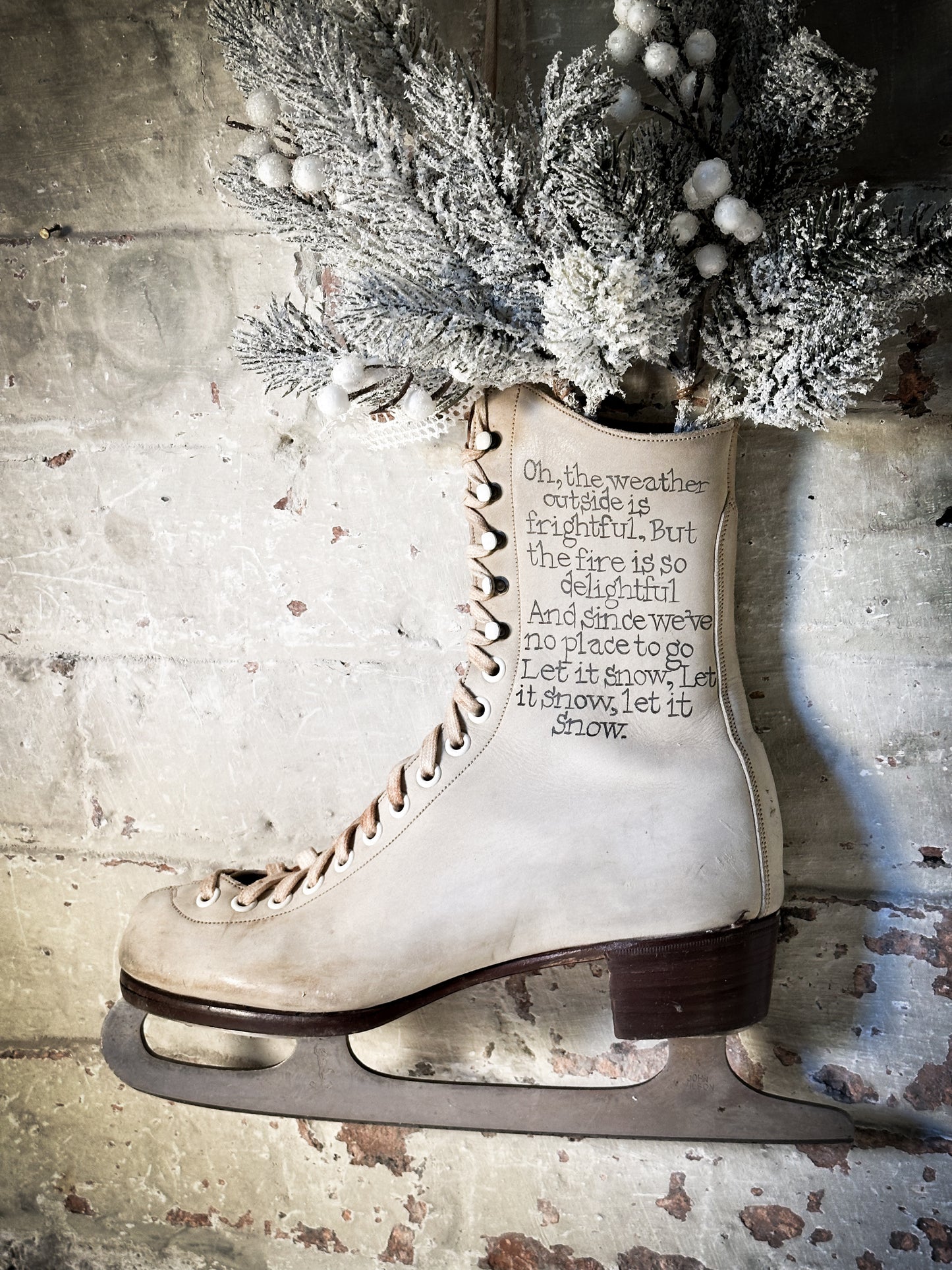 A beautiful vintage Christmas ice skate hand painted using traditional sign writer’s techniques and materials