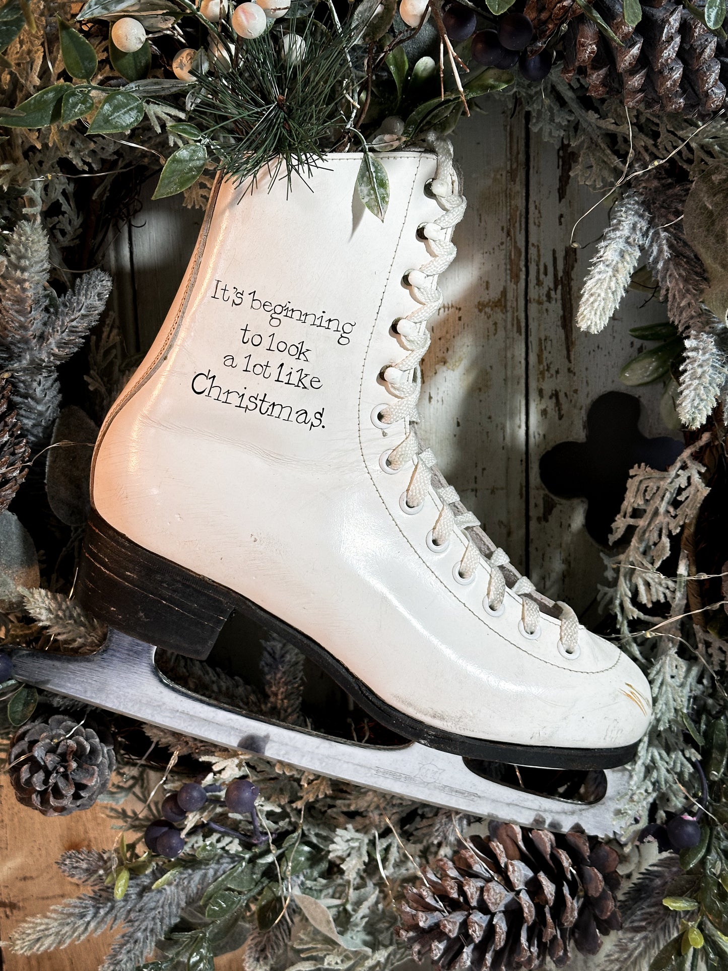 A beautiful vintage Christmas ice skate hand painted using traditional sign writer’s techniques and materials