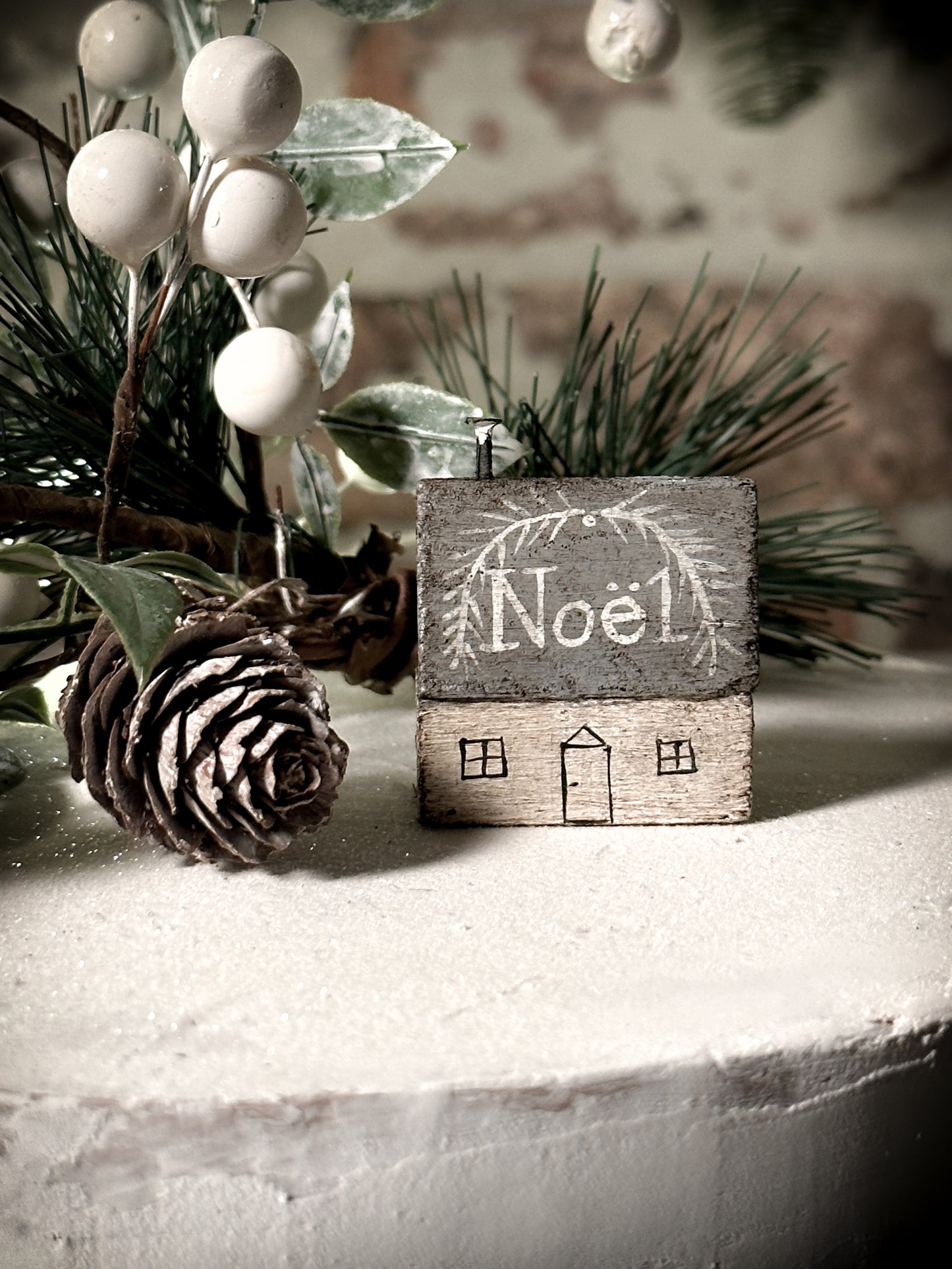 A pretty vintage German Erzgebirge Putz wooden village house painted with a Christmas quote