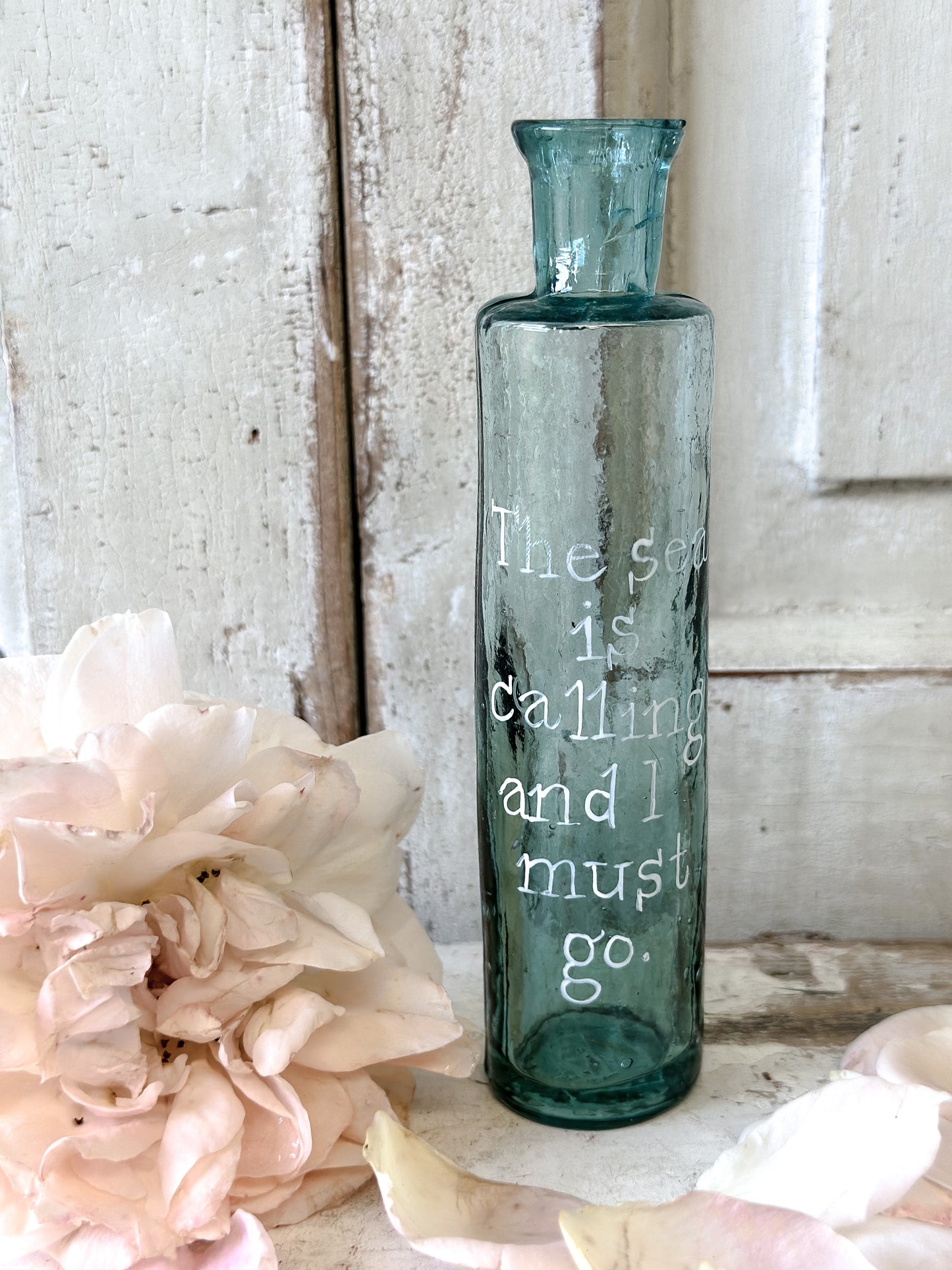 A beautiful Victorian bottle with a hand painted quote