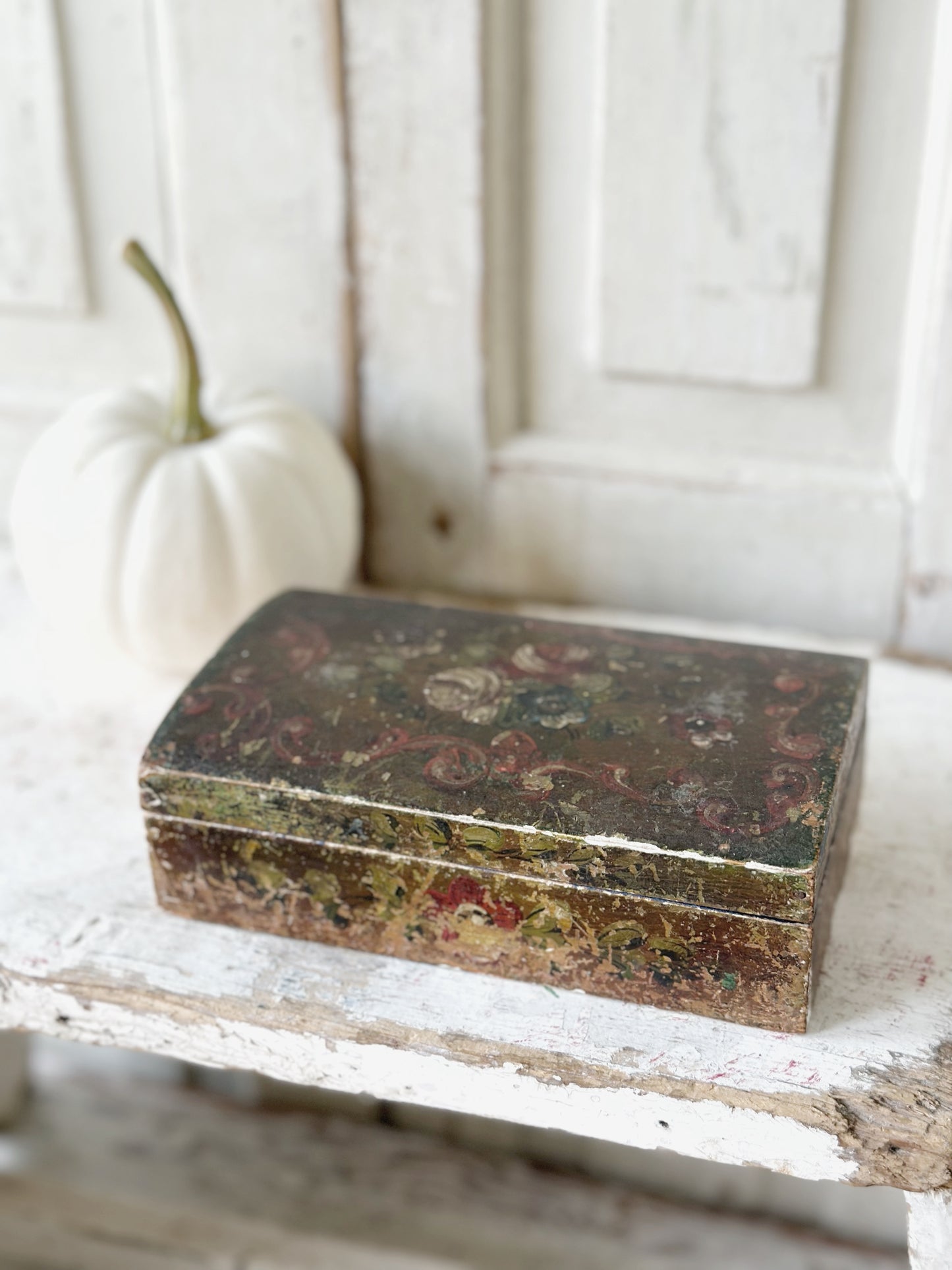 A beautiful antique painted box with floral detail