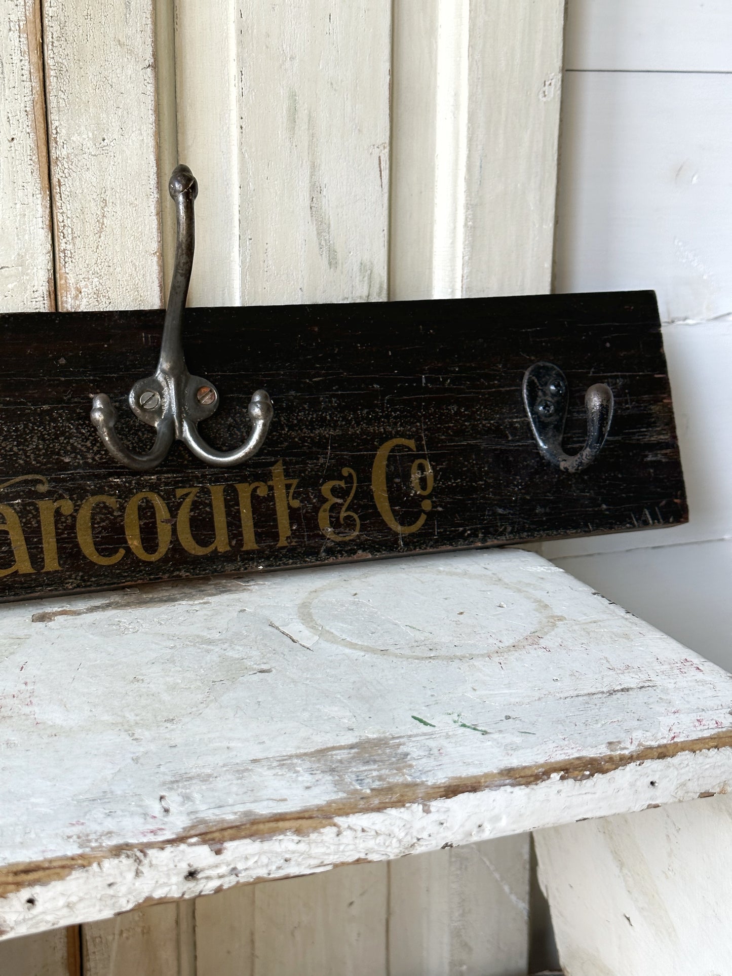 Salvaged sign written drawer front coat pegs