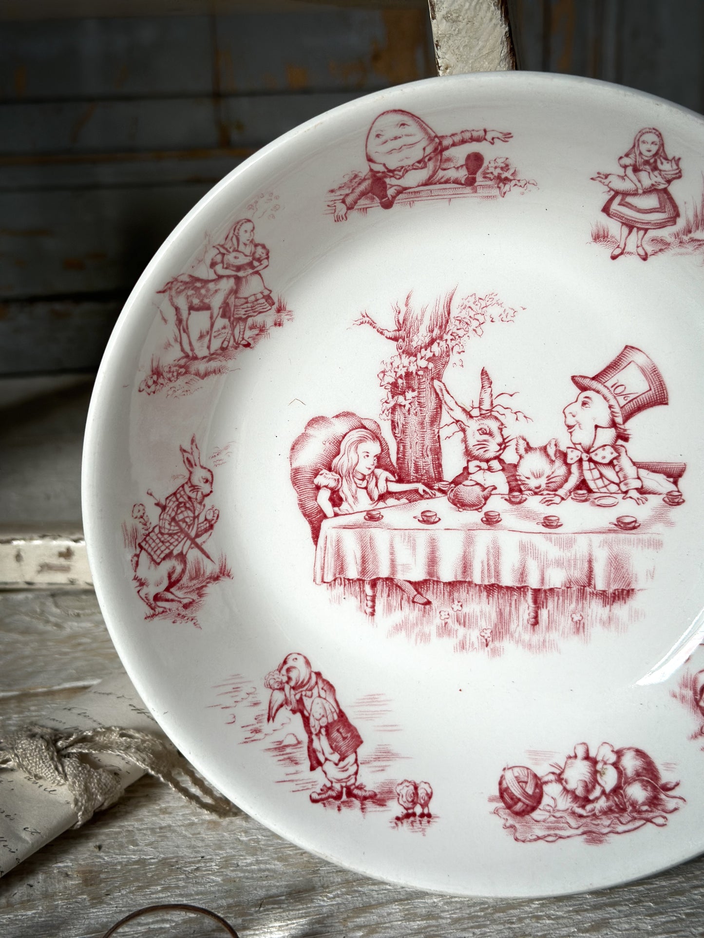 A rare Alice in Wonderland Johnson Bros. Red and white transfer dish