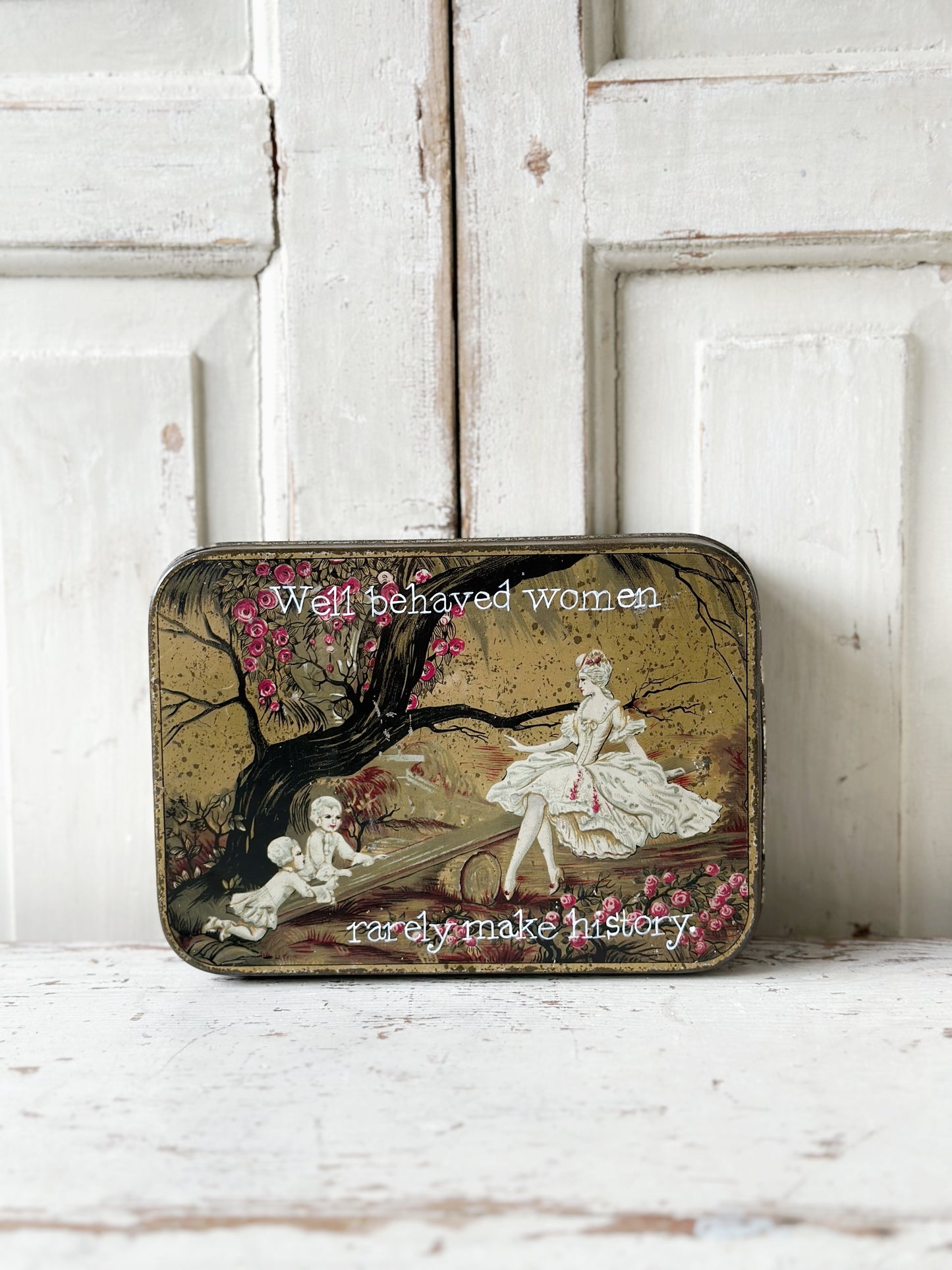 A pretty antique tin with a hand painted quote.
