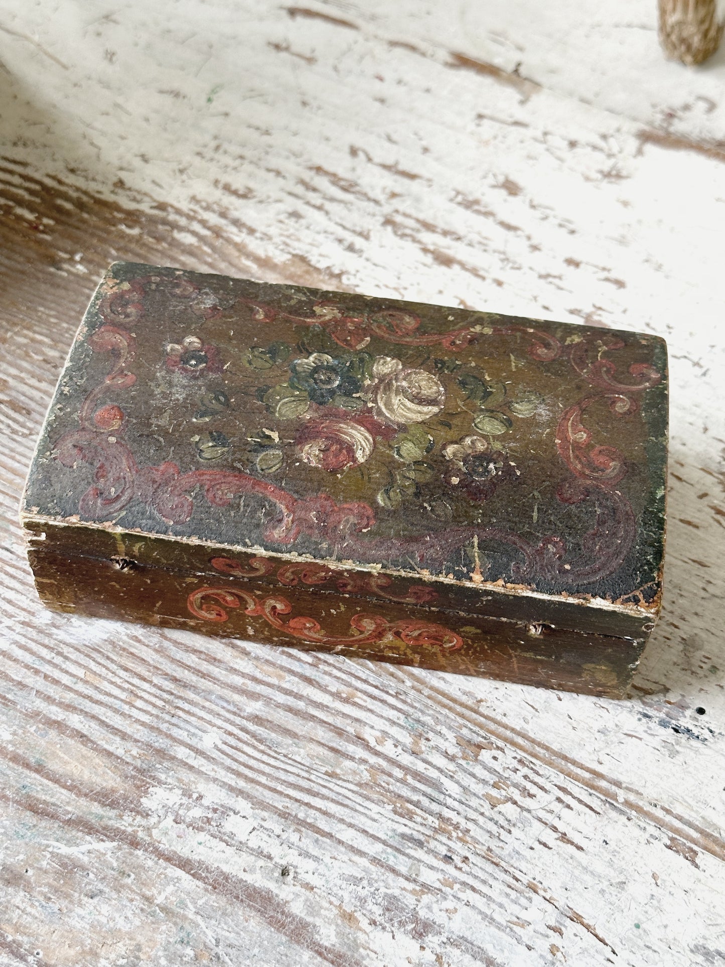 A beautiful antique painted box with floral detail