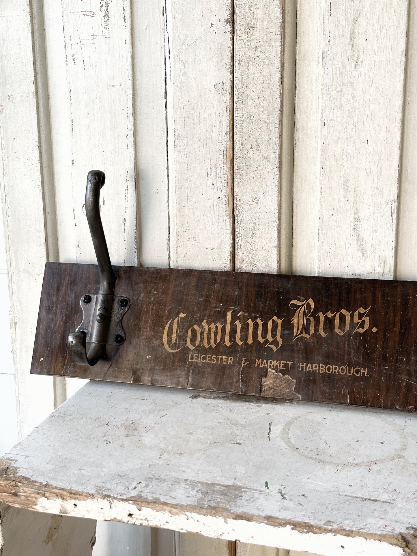 Salvaged sign written drawer front coat pegs