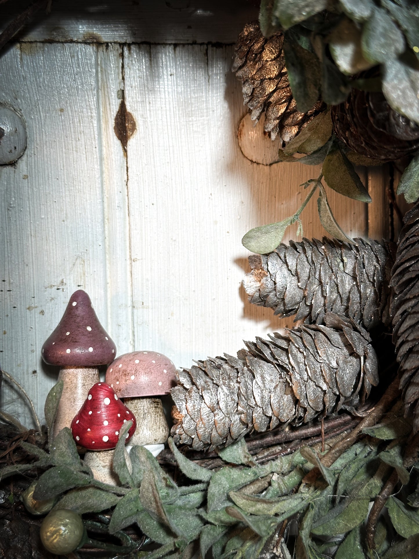 A wooden hand painted and trimmed Christmas village toadstool